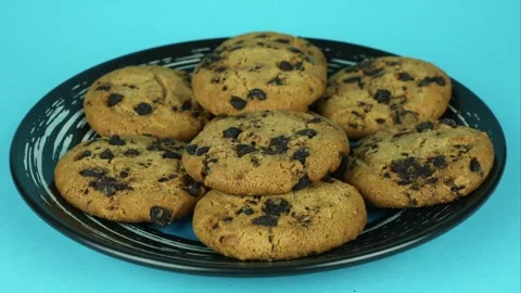 American chocolate chip cookie close up. Pastries on a plate. Stop motion Stock Footage 254976505