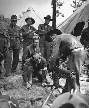 American civilian/soldier trainees receiving basic machine gun instruction from  Stock Photos