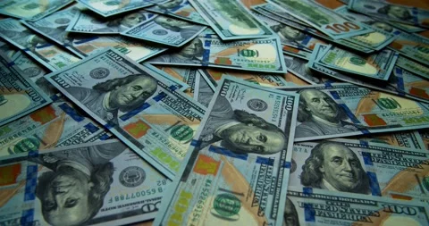 American dollar banknotes falling one after another on the table close up Stock Footage 151719882