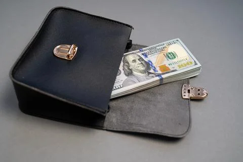 American dollar banknotes stack, pack of money in black bag, rich, corruption Stock Photos