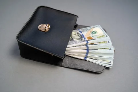 American dollar banknotes stack, pack of money in black bag, rich, corruption Stock Photos