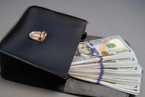 American dollar banknotes stack, pack of money in black bag, rich, corruption Stock Photos