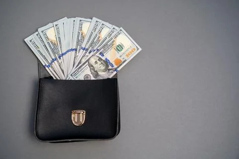 American dollar banknotes stack, pack of money in black bag, rich, corruption Stock Photos