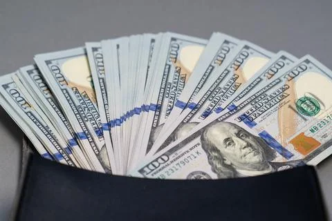 American dollar banknotes stack, pack of money in black bag, rich, corruption Stock Photos