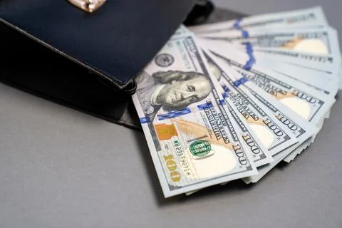 American dollar banknotes stack, pack of money in black bag, rich, corruption Stock Photos