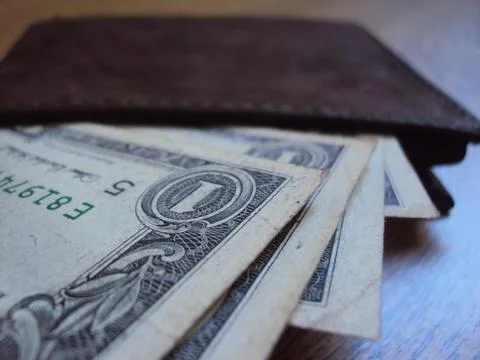 American dollar bills inside a leather wallet. Business finance and cash Stock Photos