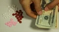 American Dollar USD, Counting Drugs and Money, Health Care, Colorful Pills HD Footage