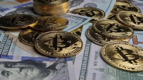American Dollars and Bitcoins on the table Stock Footage 249923040