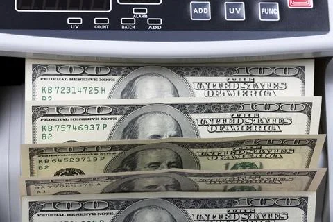 American dollars in a counting machine Stock Photos