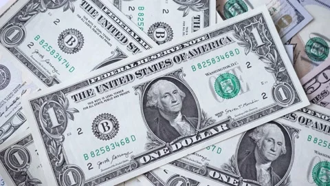 American dollars fall on the table with money close up. Stock Footage 138532801