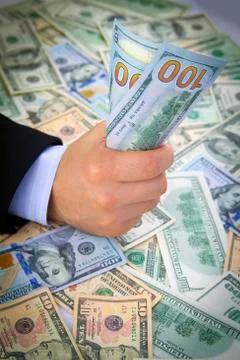 American dollars in hand Stock Photos