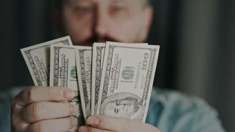 American dollars in the hands of a man. Close-up of banknotes. Businessman Stock Footage 221611152