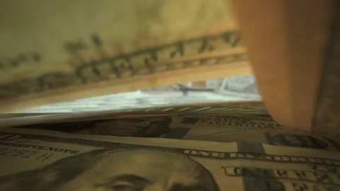 American dollars on the surface on macro shot. Many bills put on the table and Video stock 141181357