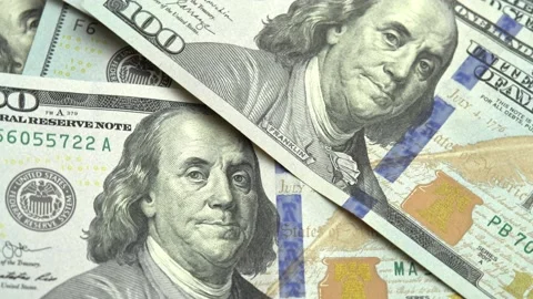 American dollars USD fall on the table, 100 US dollars counting. Concept use of Stock Footage 171525783