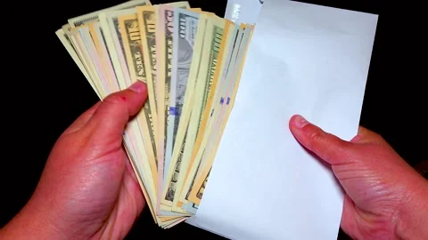 American dollor in a white cover counts banknotes with his hand Stock Footage 234140693