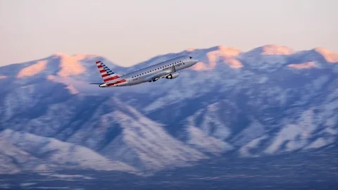 American Eagle plane takes off, Salt Lake City International Airport in winter. Stock Footage 99887799