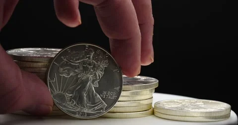 American Eagle silver coins wealth success concept close up Stock Footage 169682955