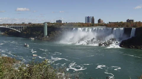 American Falls Bridge And Sightseeing Boat At Niagara Falls In Ontario, Canada Stock Footage 56394366