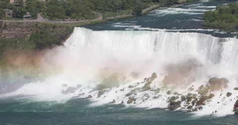 American Falls crashing into rocks with rainbow mist over the water. Stock Footage 320025341