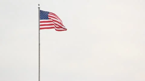 American flag against cloudy sky Stock Footage 20541440