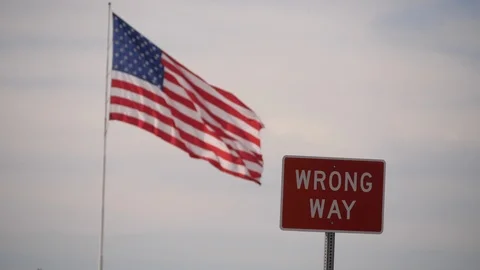 American Flag and Wrong Way SIgn Stock Footage 89114396