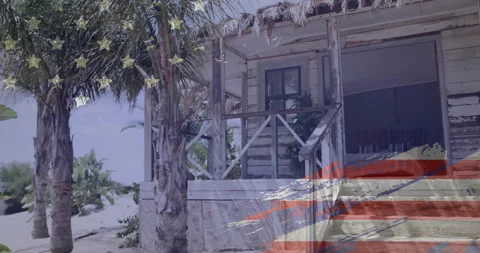 American flag animation over rustic beach house with palm trees Stock Footage 303950099
