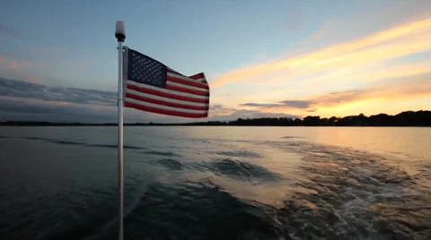 American Flag on back of boat Stock Footage 29800459