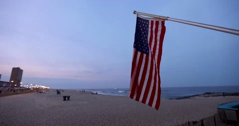 American flag on a beach Stock Footage 157376954