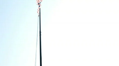 American flag being lowered from pole Stock-Footage 763580