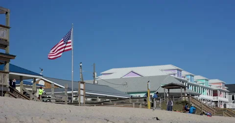 American Flag blowing on the beach Stock Footage 145492056