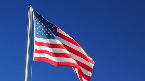 AMERICAN FLAG BLOWING IN BR Stock Footage 913160