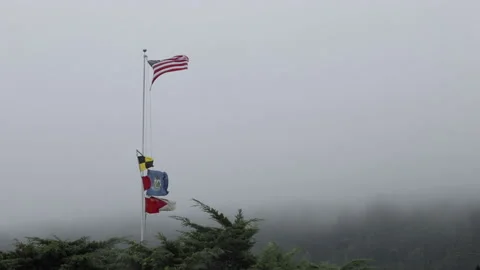 American flag blowing in a strong wind in a rainstorm. Stock Footage 148056667