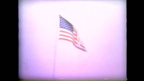 American Flag blowing in the win Stock Footage 147946678