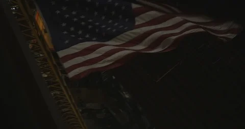 American Flag Blowing in the Wind on a Crane at Night Stock Footage 87722023