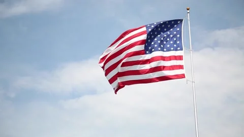 An American Flag Blowing in the Wind Stock Footage 233652709