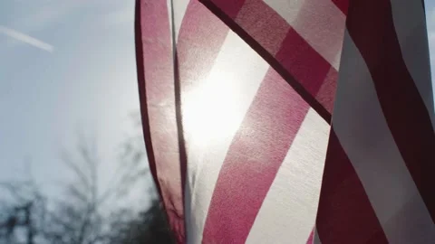 American Flag blowing in wind slow motion cinematic Stock Footage 149764380