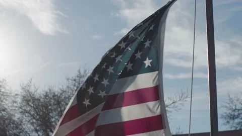 American Flag blowing in wind slow motion cinematic Stock Footage 149764900