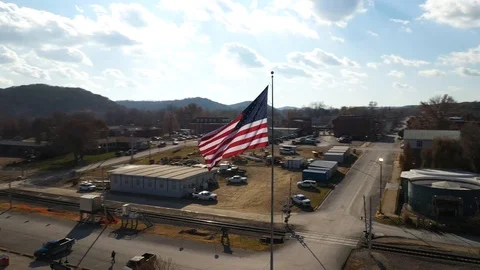 American Flag Blowing in Wind Small Town River Drone Shot 4K Stock Footage 121104117