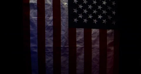 American Flag Blows in Slow Motion Dramatic Lighting Static Camera Stock Footage 134079135