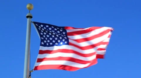 AMERICAN FLAG BLOWS IN A ST Stock Footage 948154