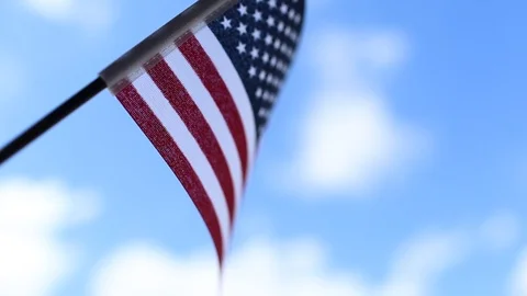 American flag on blue sky background for Memorial Day or July 4th. Stock Footage 108677189