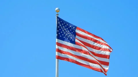 American flag on blue sky Stock Footage 133983509