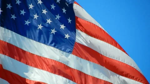American flag on blue sky Stock Footage 133983622