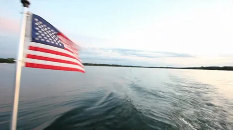 American Flag on Boat with Sunset Stock Footage 29800355