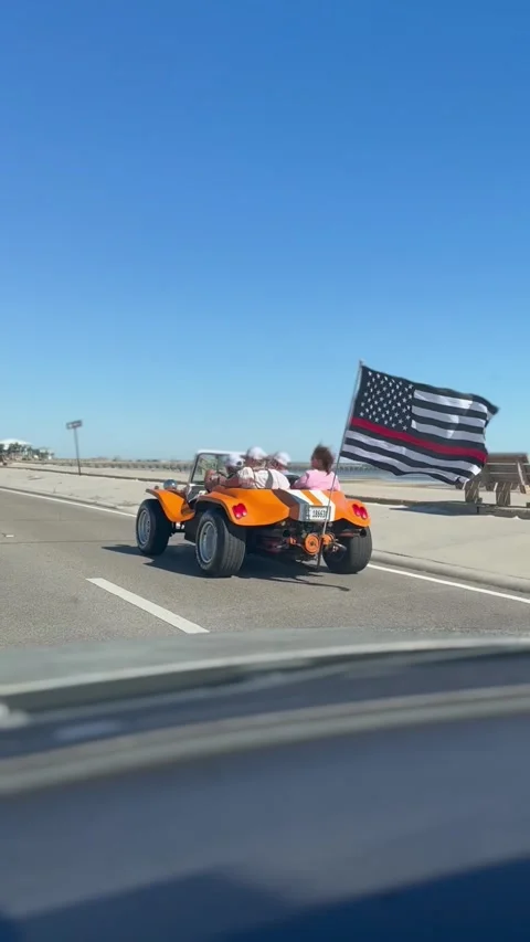 American flag on car driving down the road Stock Footage 216081886