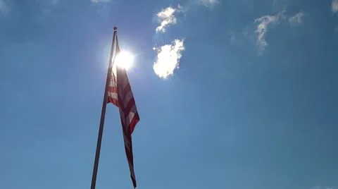 American Flag Catching the Wind 1 HD Unfurling and Flying High and Proud Stock Footage 12586141
