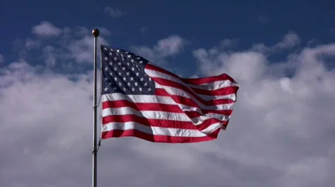 American Flag Centered in Sky 動画素材 559847