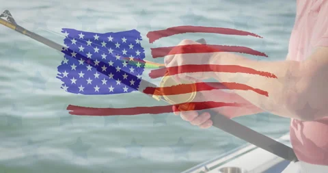 American flag design pattern against mid section of caucasian man using fishing Stock Footage 156181991