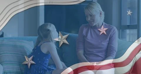 American flag design pattern against caucasian mother talking to her daughter at Stock Photos