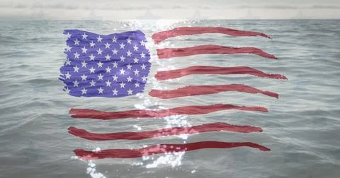 American flag design pattern against sun shining over waves in the ocean Stock Photos